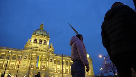 Stand-For-Ukraine,-Young-Woman-Holding-Sign-on-Protest-Against-Russian-Military-Action-and-War-in-Center-of-Prague,-Czech-Republic