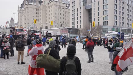 Freedom-Convoy-Trucker-Protest-COVID-19-Mandates-Anti-Vaccine-Anti-Mask-2022-Protestors-Playing-Soccer-Surrounded-by-Trucks