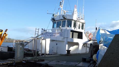 Island-reach-fishing-trawler-anchored-at-Welsh-harbour-waiting-to-depart-closeup