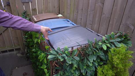 Belfast-city-council-bin-man-puts-rubbish-into-black-bin