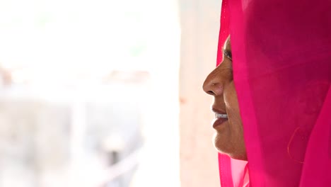 Profile-of-authentic-Indian-woman-with-fuchsia-sari