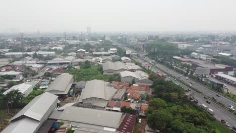 aerial-shot,-freeway-traffic-and-residential-houses