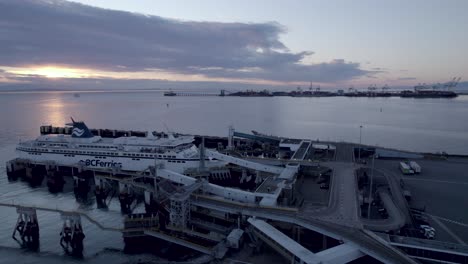 BCferries-ferry-docked-at-Tsawwassen-Vancouver-terminal-at-sunset,-British-Columbia-in-Canada