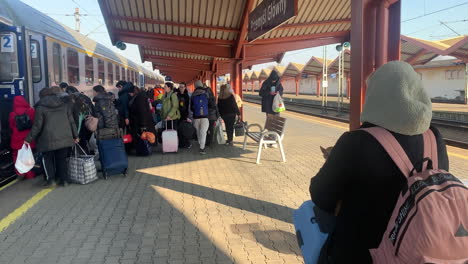 Refugees-from-the-war-with-Russia-board-a-train-in-Lviv,-Ukraine-with-children-and-pets