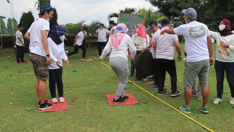 Group-of-people-playing-together-at-the-playground,-Salatiga,-Indonesia,-December-11,-2021