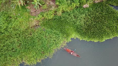 Local-African-people-on-small-boat,-wild-natural-scenery,-Nile-River