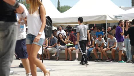 A-busy-crowd-of-young-people-walking-outside-the-Cyprus-Comic-Con-in-Nicosia,-Cyprus