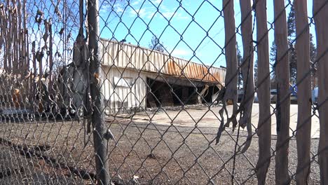 Camp-Fire-Destruction-Burned-Garage-and-Melted-Fence-Inserts