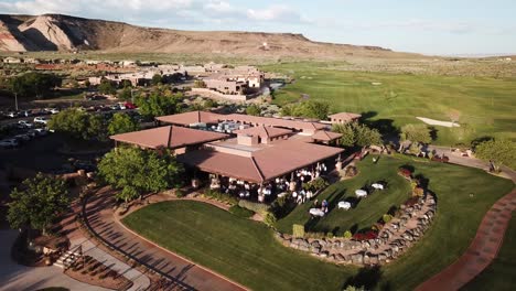 Drone-shot-of-a-a-crowd-of-people-at-a-Wedding-Reception-at-The-Ledges-Golf-Course-during-Sunset-hours