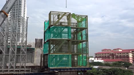 Construction-workers-working-at-height-installing-reinforcement-bar-and-form-work-at-the-construction-site