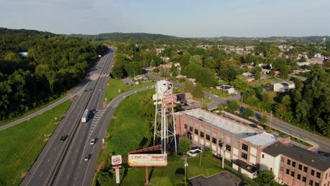 High-aerial-backwards-reveal-of-Turkey-Hill-Experience-building-and-surrounding-area