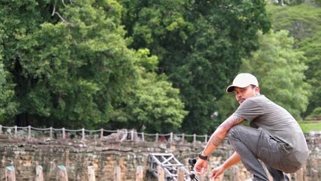 Asian-Man-Filming-Timelapse-at-Angkor-Wat-with-Action-Cam