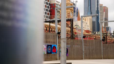 Melbourne-tourists-walking-bridge-heading-to-Flinder-Street-Station-during-daytime