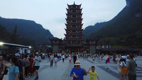 Wulingyuan,-China---August-2019-:-Crowds-of-people-leaving-the-Wulingyuan-exit-to-the-Zhangjiajie-national-park-in-the-evening,-Hunan-Province