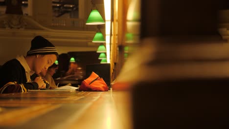 State-Library-Victoria-at-nighttime-people-studying-at-melbourne-library-Melbourne-tourism-attractions,-melbourne-library