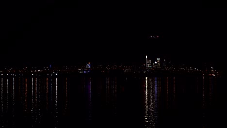 Jet-Airplane-Passes-by-Philadelphia-PA-Skyline-And-Delaware-River,-Lands-At-International-Airport,-telephoto-shot