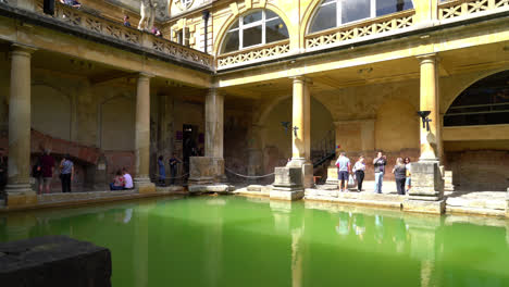 Bath-England,-Circa-:-Roman-Baths,-the-UNESCO-World-Heritage-site-with-people,-which-is-a-site-of-historical-interest-in-the-city-of-Bath,-UK