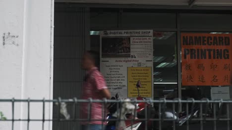 Malaysian-people-walking-along-walkway-during-covid19-pandemic-in-Kuala-Lumpur