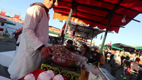 Street-vendor-in-Marrakech-Morocco-selling-babbouche,-boiled-clams