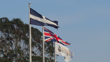 British-and-Cornish-flags-blow-on-flagpoles-in-Truro,-UK