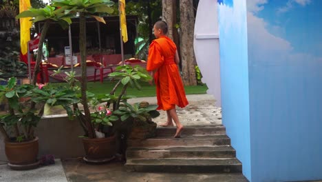 A-novice-boy-walking-the-grounds-of-the-Dragon-Temple-in-Thailand