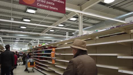 Panic-buying-and-stockpiling-in-supermarket,-Sainsbury's-in-the-UK,-occurring-as-a-result-of-the-Coronavirus-outbreak