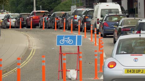 Heavy-road-traffic-due-to-installed-Covid-19-pop-up-cycle-lane,-space-to-breathe