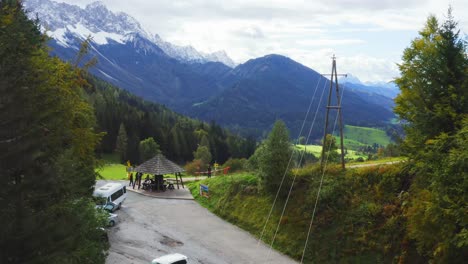 Aerial-Through-Trees-To-Reveal-Lush-Green-Valley-In-Schaidasatte,-Austria