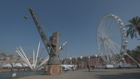 Genoa-Porto-Antico-ancient-old-port,-Bigo-attraction-and-ferris-wheel