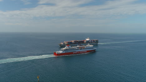 Spirit-of-Tasmania-sails-past-cargo-ship