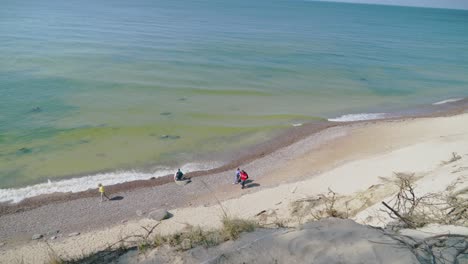 Panoramic-Shot-of-People-Walking-on-a-Beach-in-The-Dutchman's-Cap-Dune