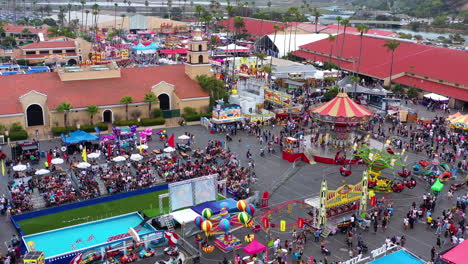 Crowd-Of-People-Having-Fun-On-Amusement-Rides-At-Del-Mar-Fairgrounds-Amidst-Pandemic-In-California,-USA