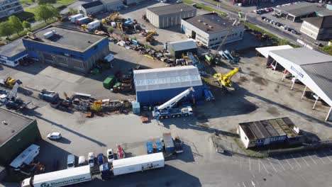 PadÃ¸y-transport-headquarter-and-company-logo-in-industrial-surroundings---Aerial-view-Bergen-Norway