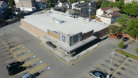 Aerial-View-of-Aldi-Supermarket.-Ascend-Pan-Down