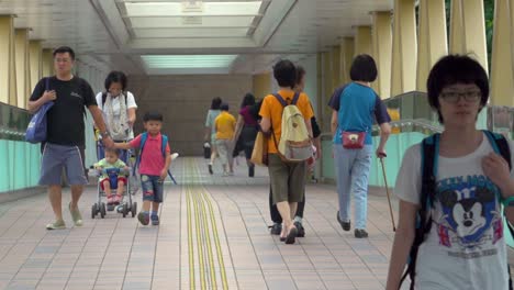 Chinese-People-Walking-At-The-Causeway-Road-Footbridge-In-Hong-Kong