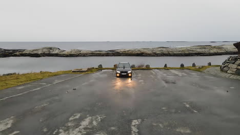 Black-BMW-Car-Parked-On-Parking-Lot-With-Headlight-And-Fog-Lights-On-In-Norway