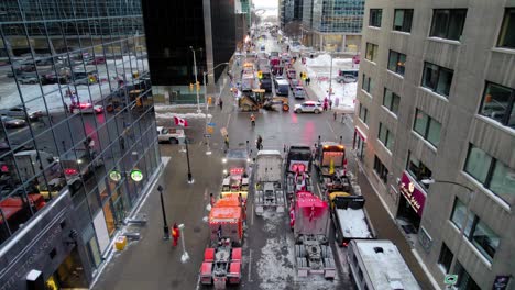 Drone-shot-of-Freedom-Trucker-Rally-on-Slater-Street-in-Ottawa,-ON-on-January-30,-2022-during-the-COVID-19-pandemic