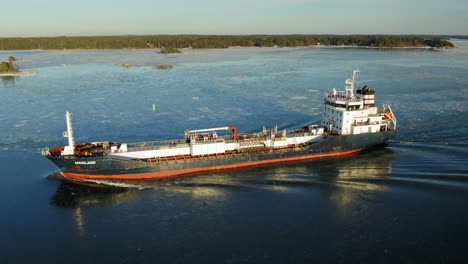 Oil-and-Chemical-tanker-MAINLAND-9HSF9-making-way-ahead-in-beautiful-Finnish-archipelago-during-winter-evening