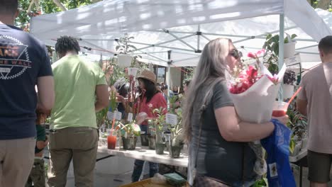 People-buying-plants-from-a-local-street-stall-in-sustainable-market