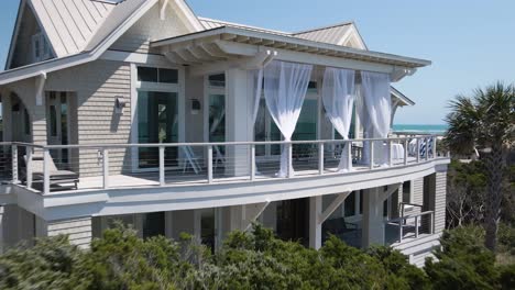 Beautiful-seafront-apartment-aerial-tracking-out-from-balcony