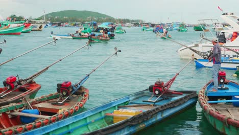 Aerial-shot-of-fisherman's-boat-sailing-in-the-Thoi-habour,-Phu-Quoc-city,-Vietnam