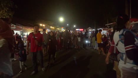 people-walking-on-car-free-night-event-in-Magelang,-Central-Java,-Indonesia-on-July-25,-2022