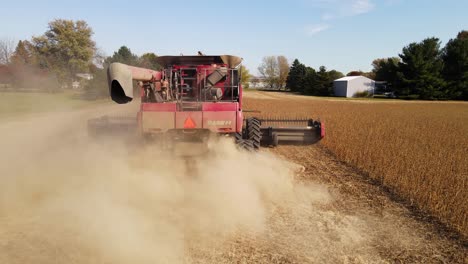 Case-8120-combine-harvesting-soybeans-in-Michigan,-USA,-aerial-view-from-behind