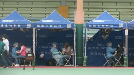 Patients-have-Coronavirus-PCR-test-at-a-Community-Testing-Centre-in-Hong-Kong