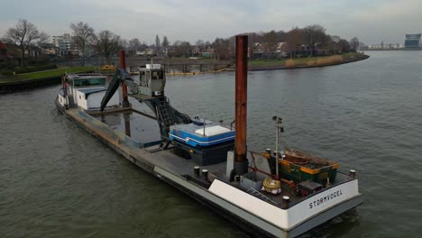 Aerial-shot-of-Stormvogel's-vessel-floating-on-the-water-of-a-river