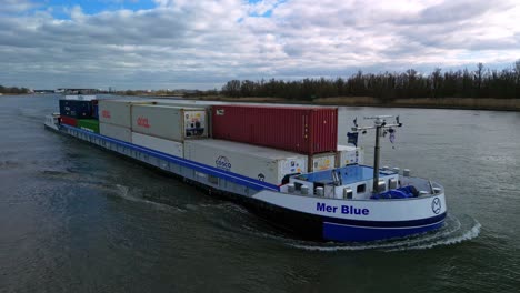 Mer-Blue's-vessel-sailing-in-a-river-while-carrying-cargo-in-Zwijndrecht-|-Rotterdam,-Netherlands