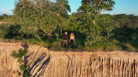 Couple-running-in-adventure-holiday-in-the-jungle-rainforest-tropical