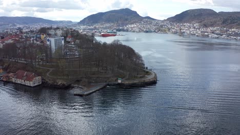 Close-aerial-of-Nordnes,-rotating-and-revealing-Damsgaard,-Puddefjord-and-Laksevaag