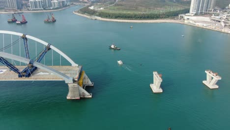 Hong-Kong-cross-bay-link-construction-project,-a-dual-two-lane-bridge-connecting-Tseung-Kwan-O-Lam-Tin-Tunnel-to-Wan-Po-Road,-Aerial-view