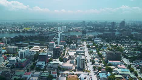 Victoria-Island-Lagos,-Nigeria---24-June-2021:-Drone-view-of-major-roads-and-traffic-in-Victoria-Island-Lagos-showing-the-cityscape,-offices-and-residential-buildings